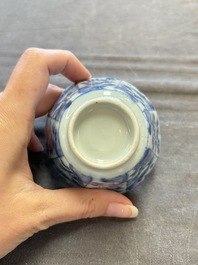 A set of 11 Chinese blue and white cups and saucers with riverscape design, Kangxi