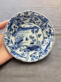A set of 11 Chinese blue and white cups and saucers with riverscape design, Kangxi