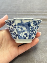 A set of 11 Chinese blue and white cups and saucers with riverscape design, Kangxi
