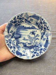 A set of 11 Chinese blue and white cups and saucers with riverscape design, Kangxi
