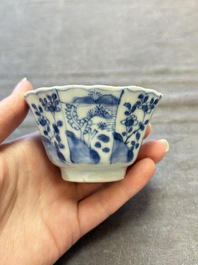 A set of 11 Chinese blue and white cups and saucers with riverscape design, Kangxi