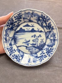 A set of 11 Chinese blue and white cups and saucers with riverscape design, Kangxi