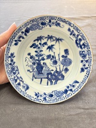 18 Chinese blue and white plates and saucers with floral design, 18th C.