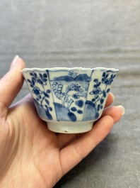 A set of 11 Chinese blue and white cups and saucers with riverscape design, Kangxi