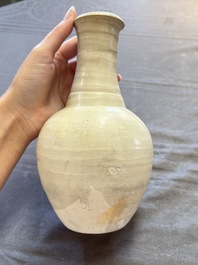 Three cream-glazed bottle vases and two jarlets from the Jepara shipwreck, Dehua or Anxi kilns, Song