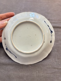 A set of 11 Chinese blue and white cups and saucers with riverscape design, Kangxi