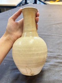 Three cream-glazed bottle vases and two jarlets from the Jepara shipwreck, Dehua or Anxi kilns, Song