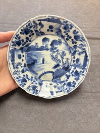 A set of 11 Chinese blue and white cups and saucers with riverscape design, Kangxi