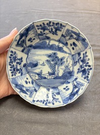 A set of 11 Chinese blue and white cups and saucers with riverscape design, Kangxi