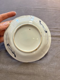 A set of 11 Chinese blue and white cups and saucers with riverscape design, Kangxi