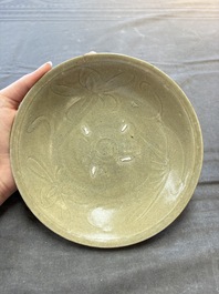 Three Chinese celadon-glazed plates and two bowls from the Jepara shipwreck,  Fujian or Zhejiang kilns, Song