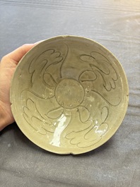 A group of 12 Chinese celadon-glazed bowls with incised floral design from the Jepara shipwreck, Fujian kilns, Song