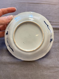 A set of 11 Chinese blue and white cups and saucers with riverscape design, Kangxi