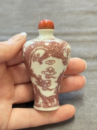 A Chinese blue, white and copper-red 'dragon' snuff bottle, 19th C.