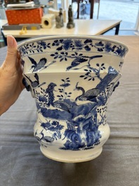 A pair of Chinese blue and white 'birds among flowering branches' jardini&egrave;res, 19th C.