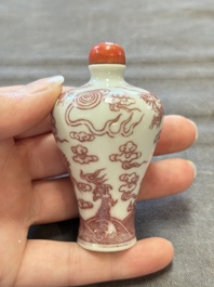 A Chinese blue, white and copper-red 'dragon' snuff bottle, 19th C.