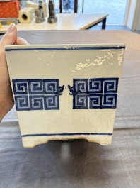 A Chinese blue and white 'chilong' square jardini&egrave;re, 19th C.
