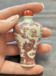A Chinese blue, white and copper-red 'dragon' snuff bottle, 19th C.