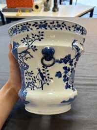 A pair of Chinese blue and white 'birds among flowering branches' jardini&egrave;res, 19th C.