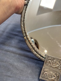 A Chinese silver-plated oval mirror, 19/20th C.
