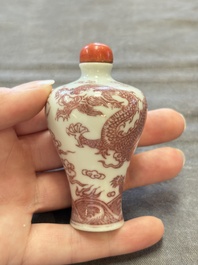 A Chinese blue, white and copper-red 'dragon' snuff bottle, 19th C.