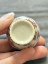 A Chinese blue, white and copper-red 'dragon' snuff bottle, 19th C.
