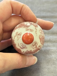 A Chinese blue, white and copper-red 'dragon' snuff bottle, 19th C.