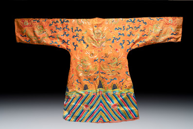 A Chinese embroidered silk salmon-ground 'dragon' robe, 19th C.