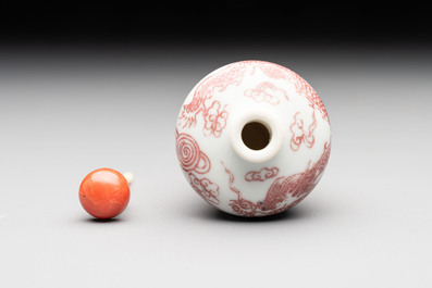 A Chinese blue, white and copper-red 'dragon' snuff bottle, 19th C.