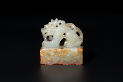 A Chinese celadon and russet jade 'dragon' seal, 18/19th C.
