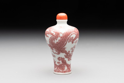 A Chinese blue, white and copper-red 'dragon' snuff bottle, 19th C.