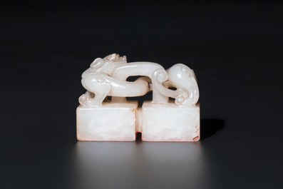 A Chinese celadon and russet jade 'chilong' seal, 18/19th C.