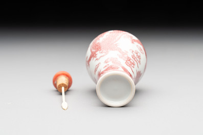 A Chinese blue, white and copper-red 'dragon' snuff bottle, 19th C.