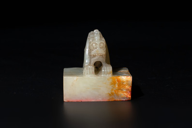 A Chinese celadon and russet jade 'dragon' seal, 18/19th C.