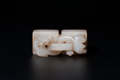 A Chinese celadon and russet jade 'chilong' seal, 18/19th C.