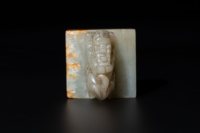 A Chinese celadon and russet jade 'dragon' seal, 18/19th C.