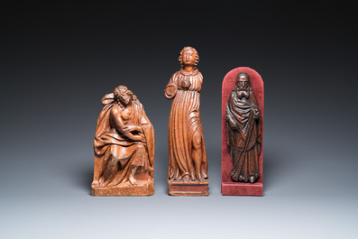 Three carved wooden sculptures of the Pensive Christ, Antonius the Great and a Saint, 16th C.