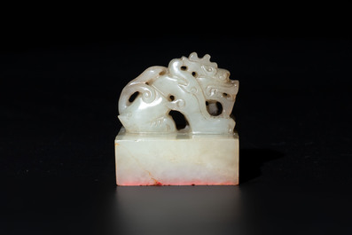 A Chinese celadon and russet jade 'dragon' seal, 18/19th C.