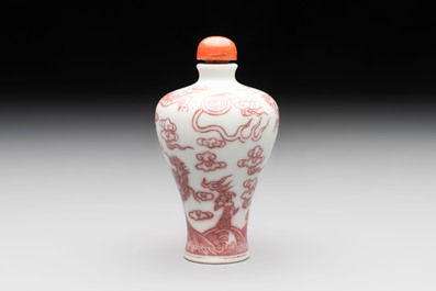 A Chinese blue, white and copper-red 'dragon' snuff bottle, 19th C.