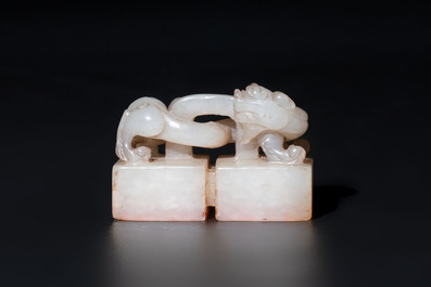 A Chinese celadon and russet jade 'chilong' seal, 18/19th C.