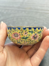 A pair of Chinese yellow-ground Canton enamel covered bowls and two cups, Yongzheng/Qianlong
