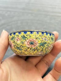 A pair of Chinese yellow-ground Canton enamel covered bowls and two cups, Yongzheng/Qianlong