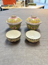 A pair of Chinese yellow-ground Canton enamel covered bowls and two cups, Yongzheng/Qianlong