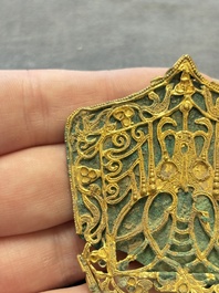A fine Chinese gold and bronze plaque from a hat ornament, Wei/Jin