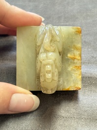 A Chinese celadon and russet jade 'dragon' seal, 18/19th C.