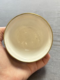 A pair of Chinese yellow-ground Canton enamel covered bowls and two cups, Yongzheng/Qianlong