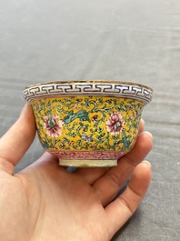 A pair of Chinese yellow-ground Canton enamel covered bowls and two cups, Yongzheng/Qianlong