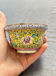 A pair of Chinese yellow-ground Canton enamel covered bowls and two cups, Yongzheng/Qianlong