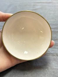 A pair of Chinese yellow-ground Canton enamel covered bowls and two cups, Yongzheng/Qianlong