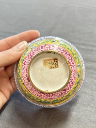 A pair of Chinese yellow-ground Canton enamel covered bowls and two cups, Yongzheng/Qianlong